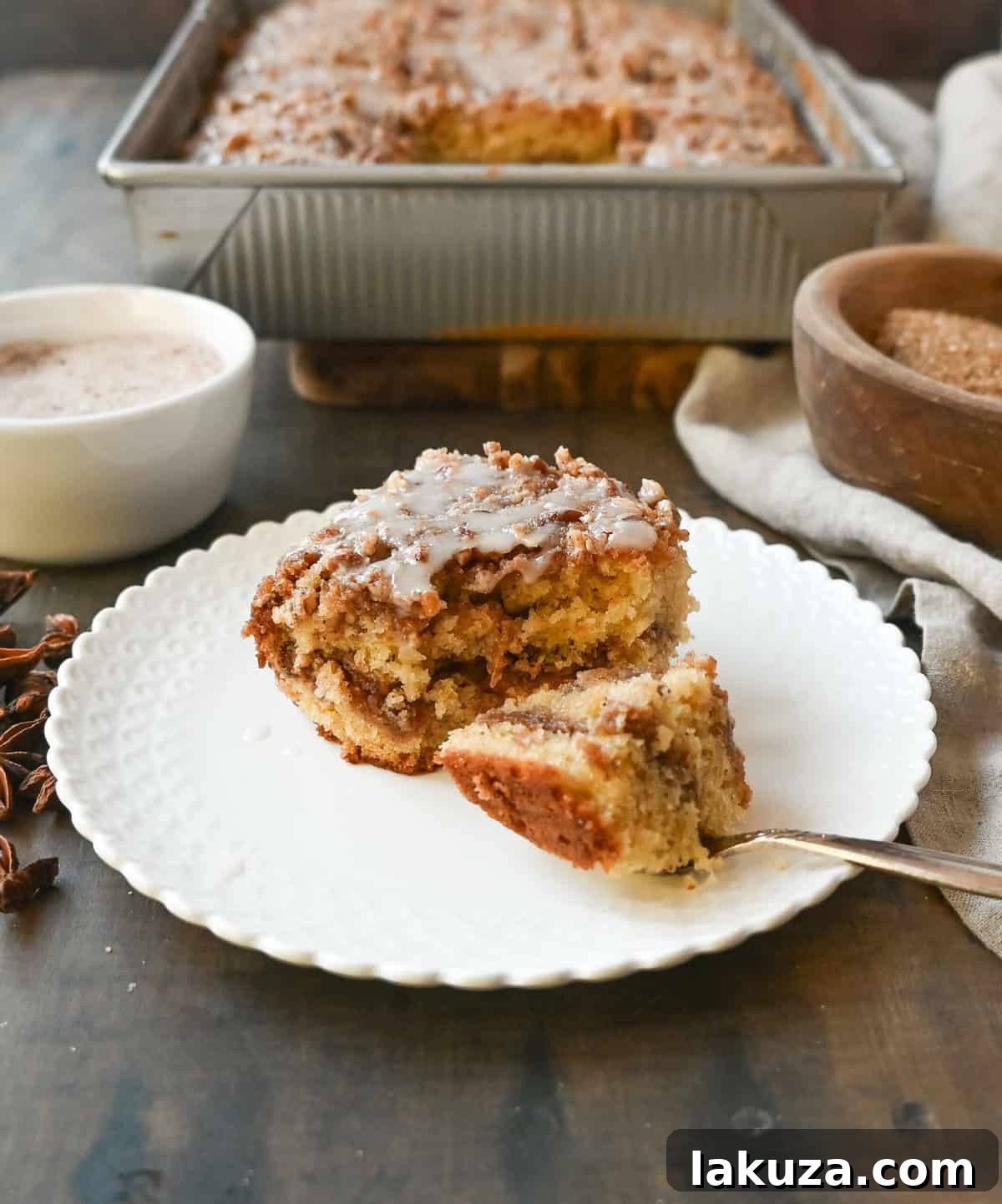 Best Coffee Cake Recipe. This cinnamon brown sugar sour cream coffee cake is made with a buttery cake layered with a brown sugar cinnamon layer and topped with a streusel topping and a sweet glaze. The best coffee cake recipe perfect for breakfast or brunch.