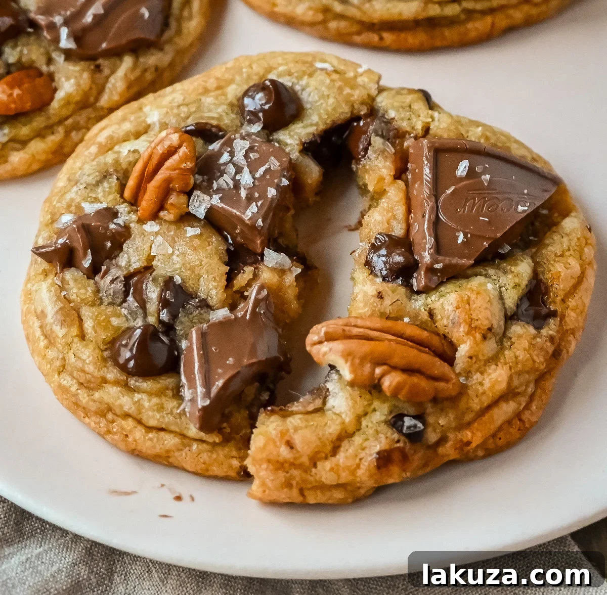 Golden Brown Butter Pecan Chocolate Chunk Delights 7 A stunning stack of Browned Butter Pecan Chocolate Chunk Cookies, showcasing their thick, chewy texture.