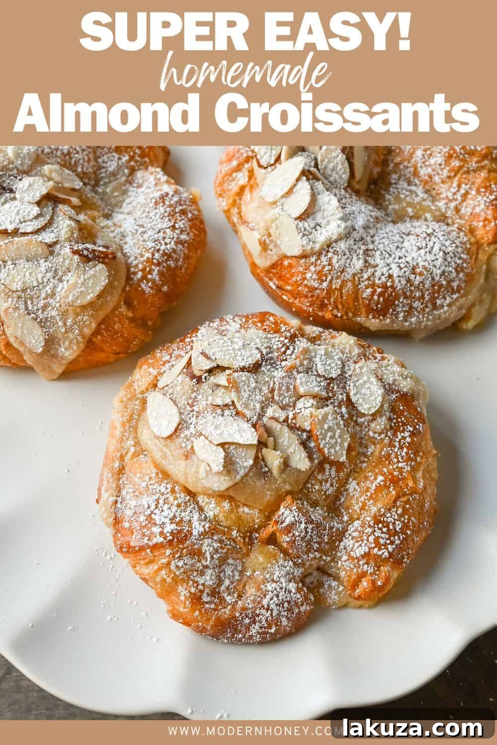 A stunning vertical shot of multiple easy homemade almond croissants stacked, dusted with powdered sugar, ready to eat.