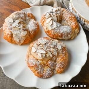 Easy Almond Croissants. How to make the easiest homemade almond croissants ever! These buttery, flaky croissants filled with a homemade almond filling and topped with crunchy almonds will rival any bakery. You can make these bakery-style almond croissants in 25 minutes!