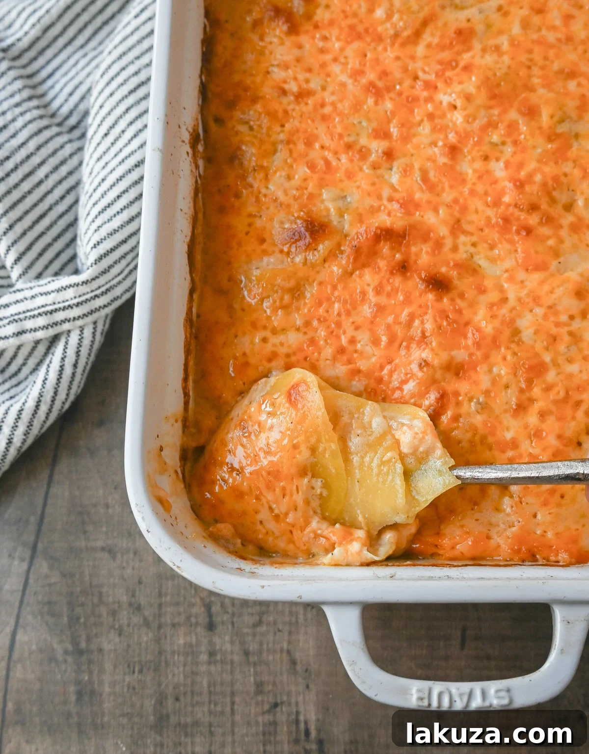 Golden brown cheesy scalloped potatoes, fresh out of the oven, bubbling and ready to serve.