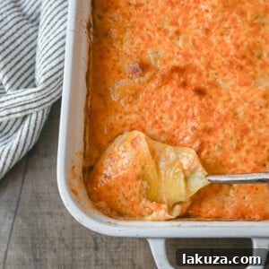 Cheesy Scalloped Potatoes: a perfect side dish made with thinly sliced potatoes, a decadent béchamel sauce, and layers of cheese, baked until melted and bubbly.