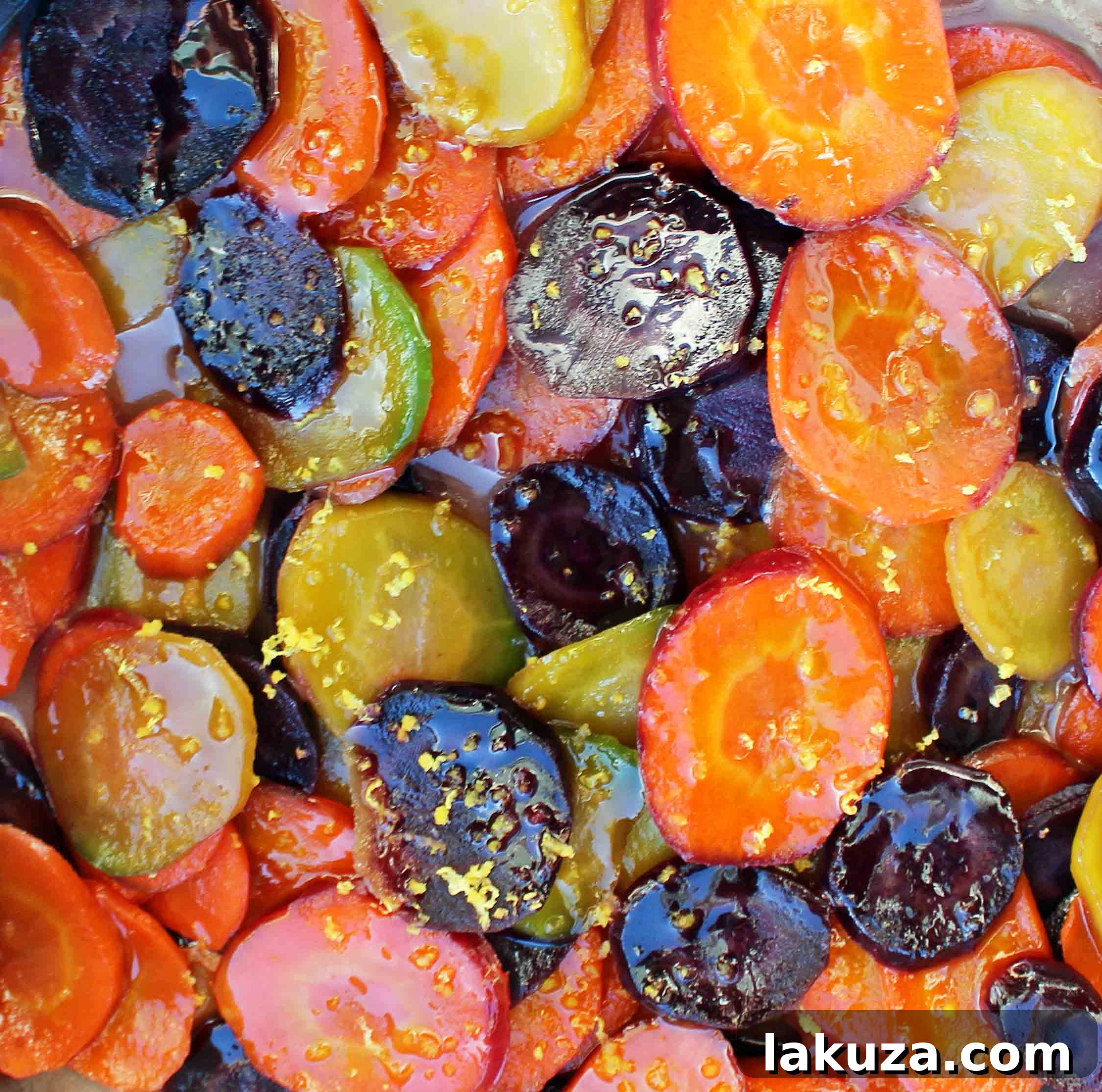 Honey butter glazed carrots being prepared on a rustic outdoor table
