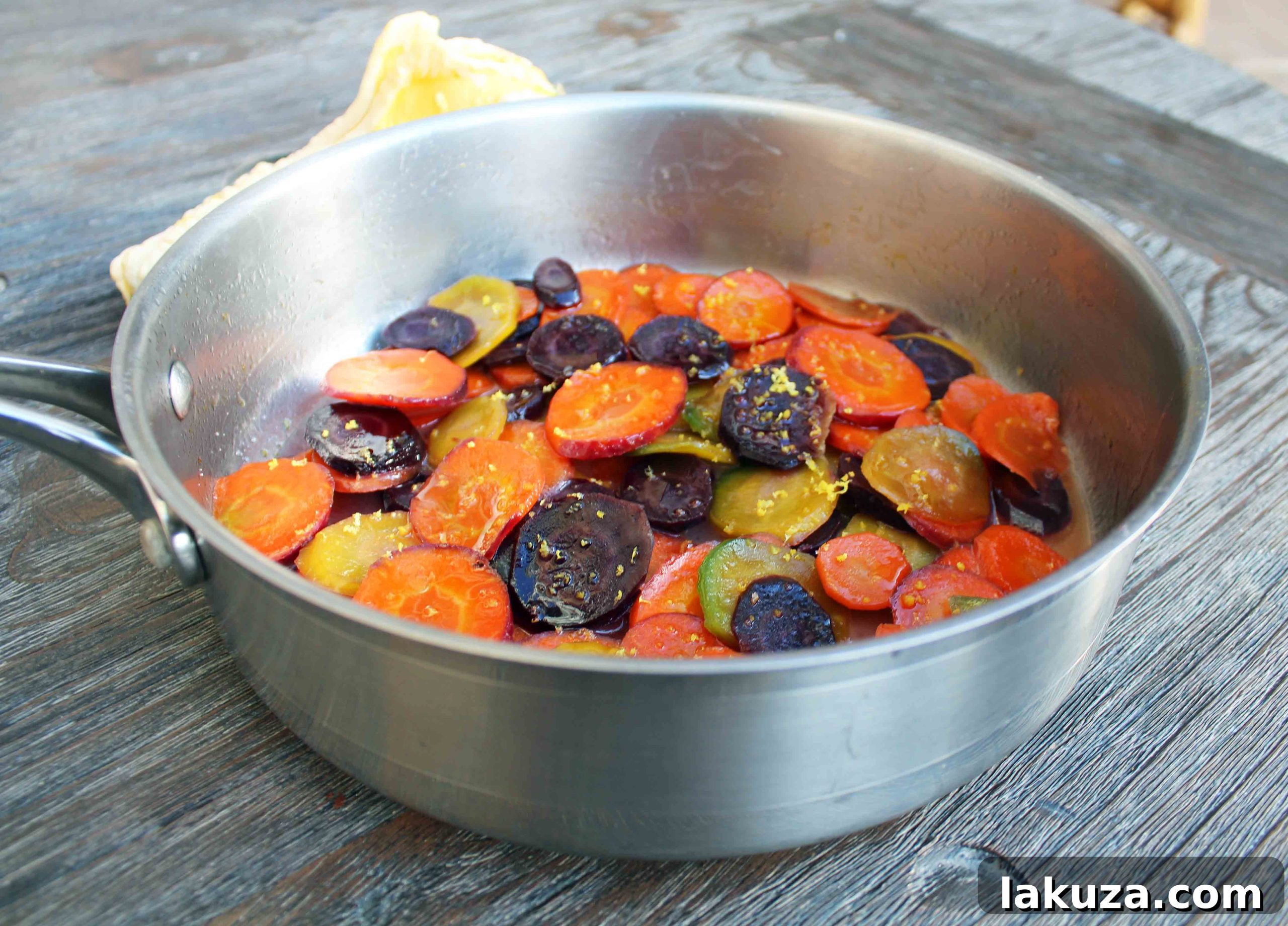 Outdoor shot of honey butter glazed carrots on a wooden table, fall decor