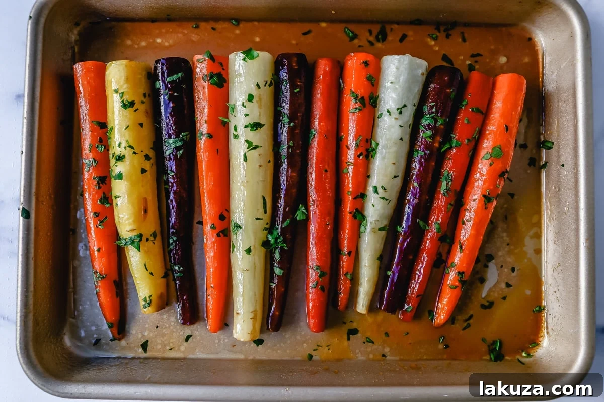 Freshly roasted honey glazed carrots with lemon zest, ready to serve