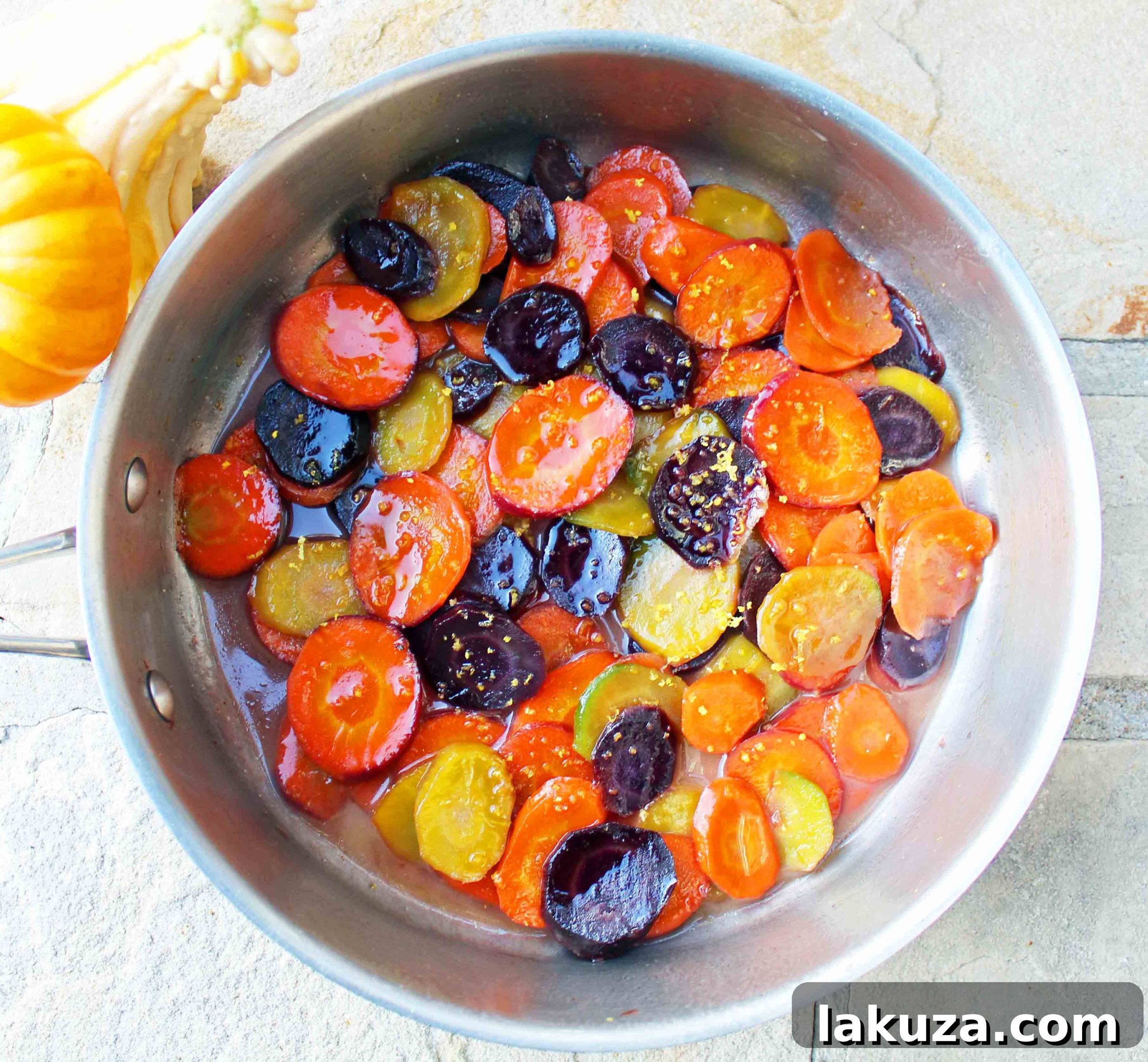 Honey butter glazed heirloom carrots arranged beautifully on a plate