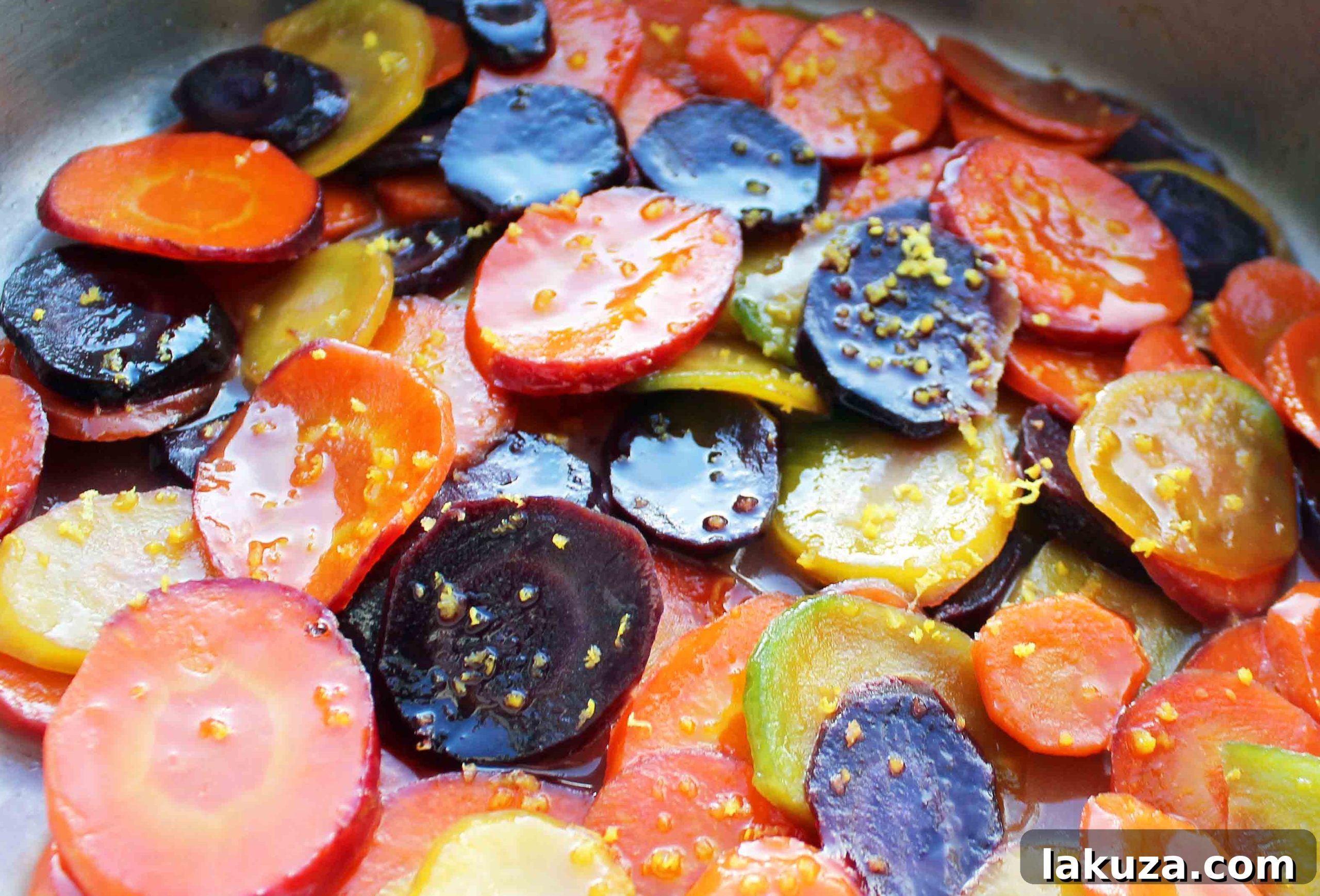 Rustic presentation of honey butter glazed carrots with a fork