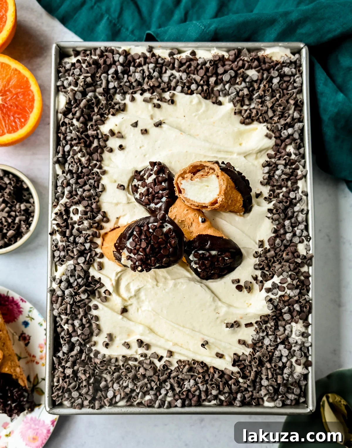 Cannoli Sheet Cake. A light and fluffy yellow chocolate chip cake topped with a sweet ricotta cream topping and mini chocolate chips. All of the flavor of a cannoli in a delicious cake.