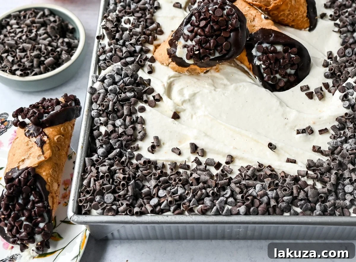 Cannoli Sheet Cake. A light and fluffy yellow chocolate chip cake topped with a sweet ricotta cream topping and mini chocolate chips. All of the flavor of a cannoli in a delicious cake.