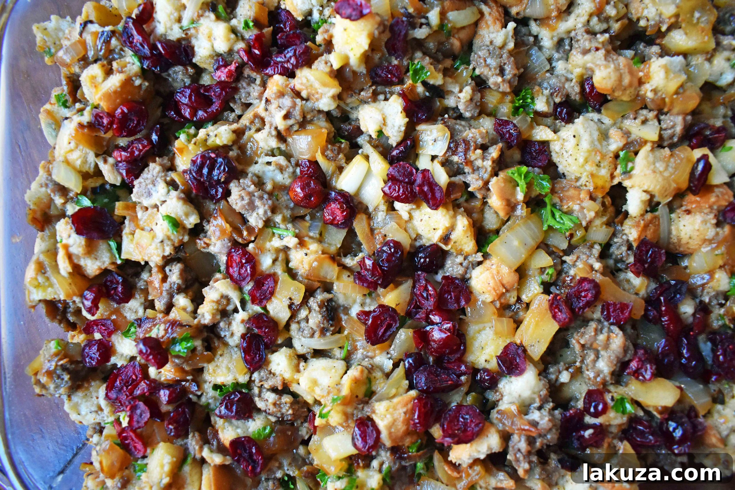 A baking dish full of Cranberry Apple Sausage Stuffing, cooling after being removed from the oven.