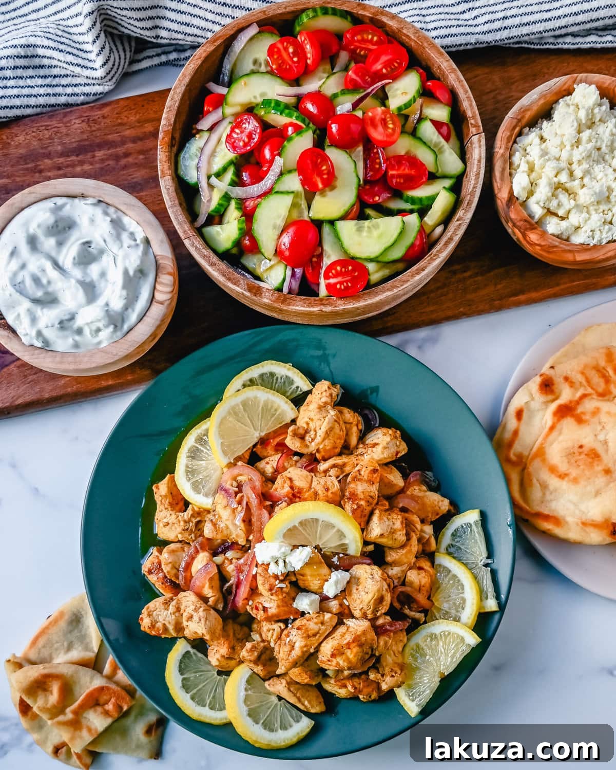 Delicious Oven-Roasted Chicken Shawarma served with pita bread and fresh vegetables.
