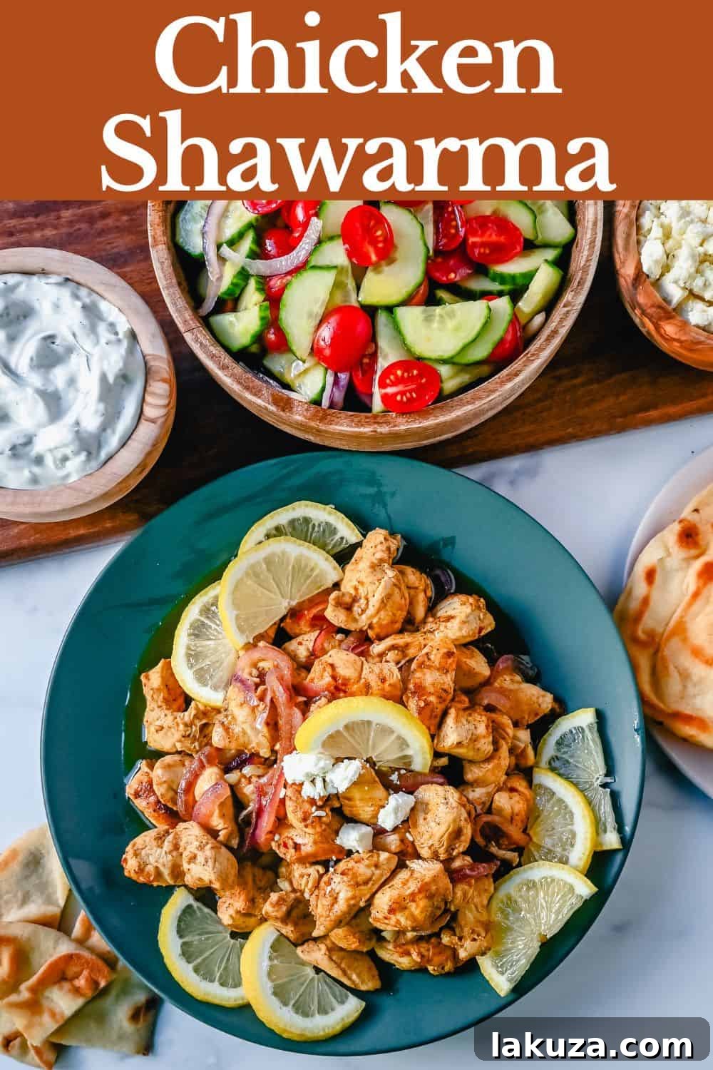 Beautifully arranged Oven Roasted Chicken Shawarma platter with various side dishes.