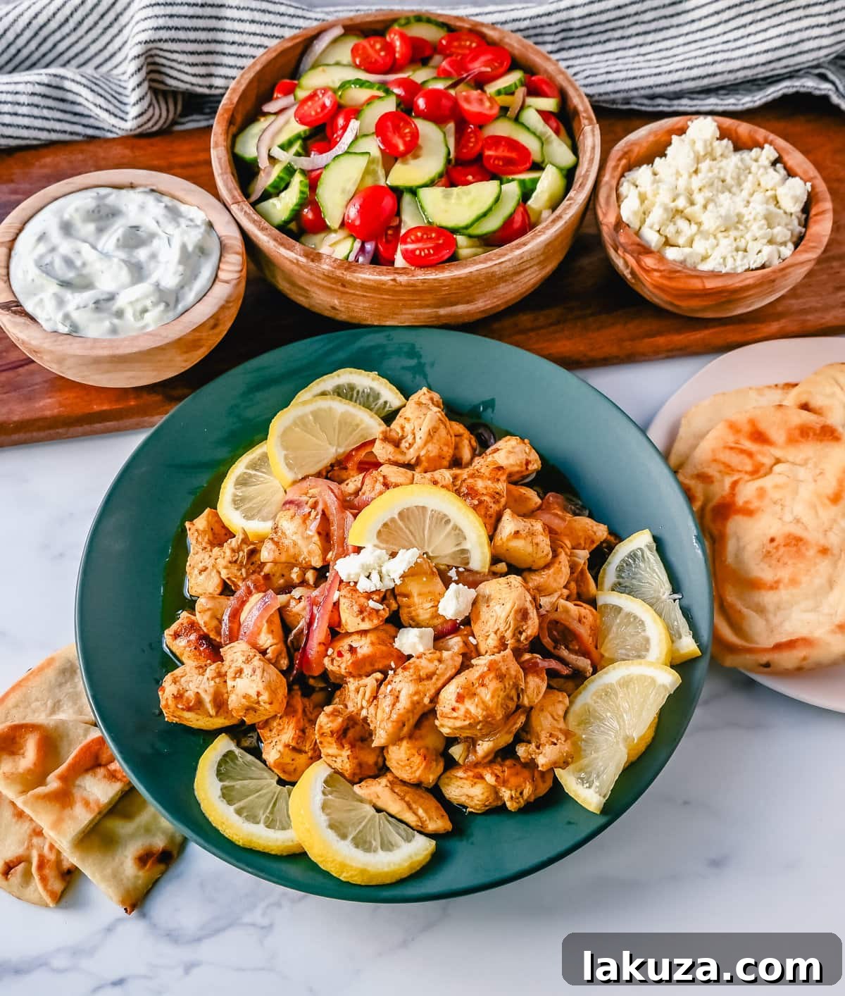A serving of oven-roasted chicken shawarma with fresh toppings.