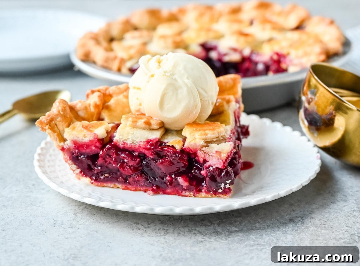 Homemade cherry pie is bursting with sweet-tart cherries nestled in a flaky, golden crust and topped with vanilla bean ice cream. I am sharing tips and tricks for making sweet cherry pie at home.
