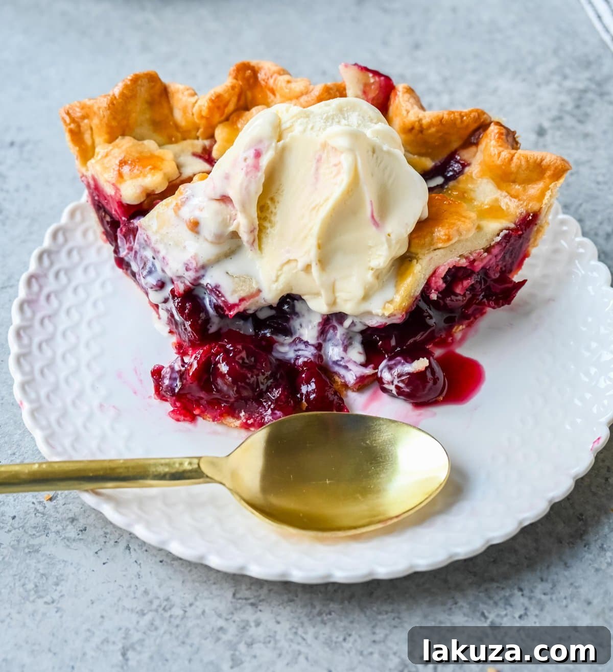 Homemade cherry pie is bursting with sweet-tart cherries nestled in a flaky, golden crust and topped with vanilla bean ice cream. I am sharing tips and tricks for making sweet cherry pie at home.