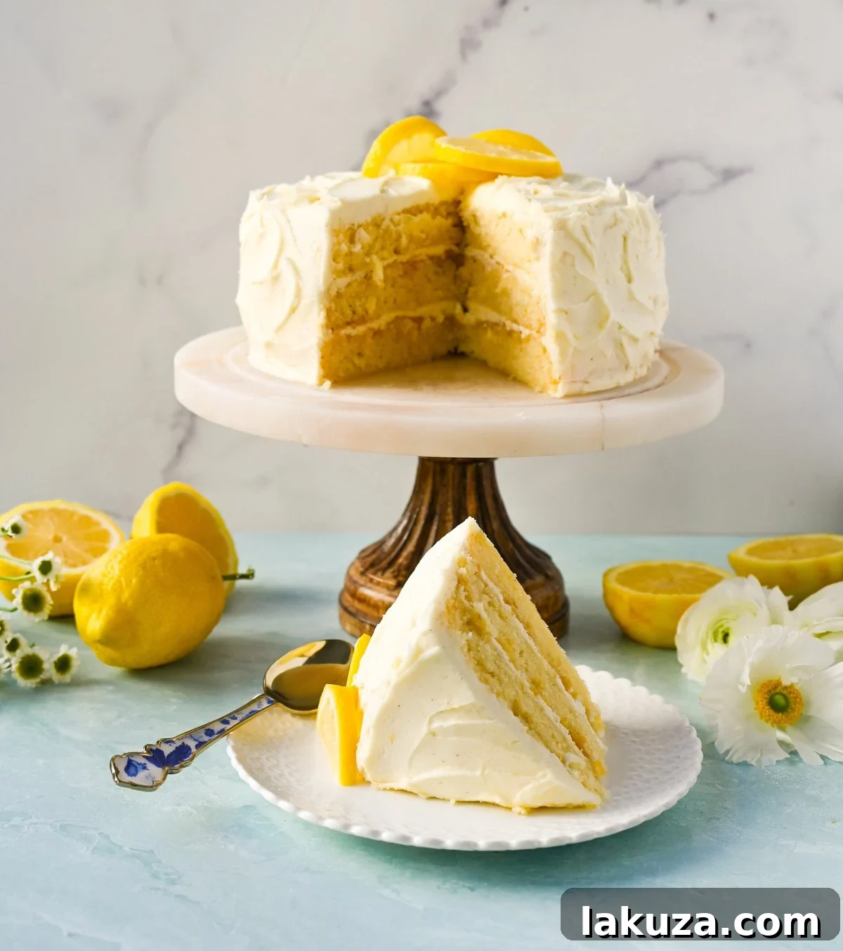 Elegant Lemon Layer Cake, perfectly frosted with lemon cream cheese and adorned with fresh lemon slices, ready to be served.