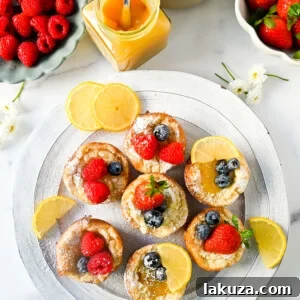 Mini Dutch Baby Pancakes (in a muffin tin). These mini, bite-size Dutch Baby pancakes are made the same way as traditional German pancakes but these are baked in muffin tins. These easy, golden and buttery mini puffed pancakes are perfect to serve to family and friends.