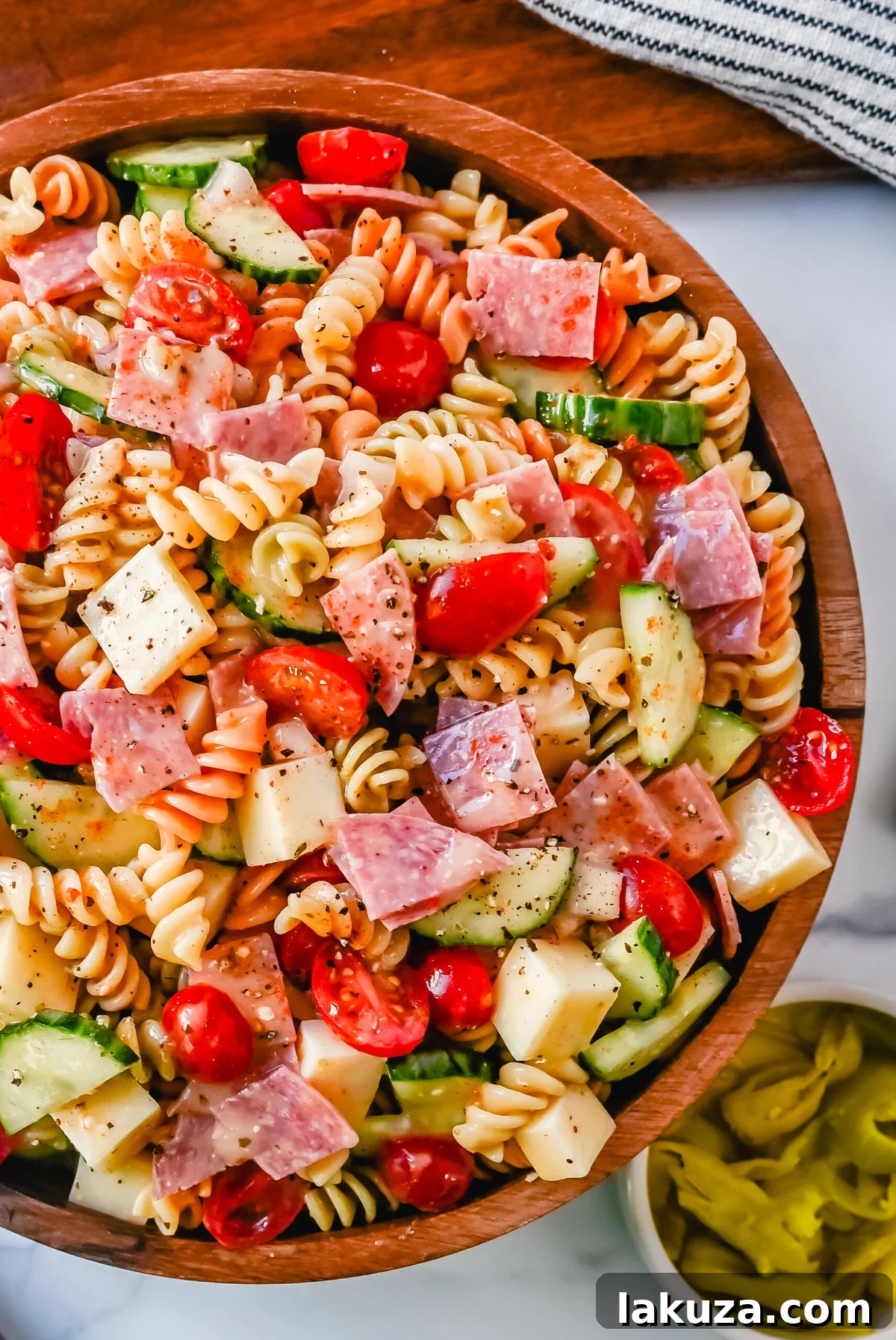 A close-up of the Easy Pasta Salad, showing the texture of the pasta and the generous coating of dressing and seasoning, ready to be served.