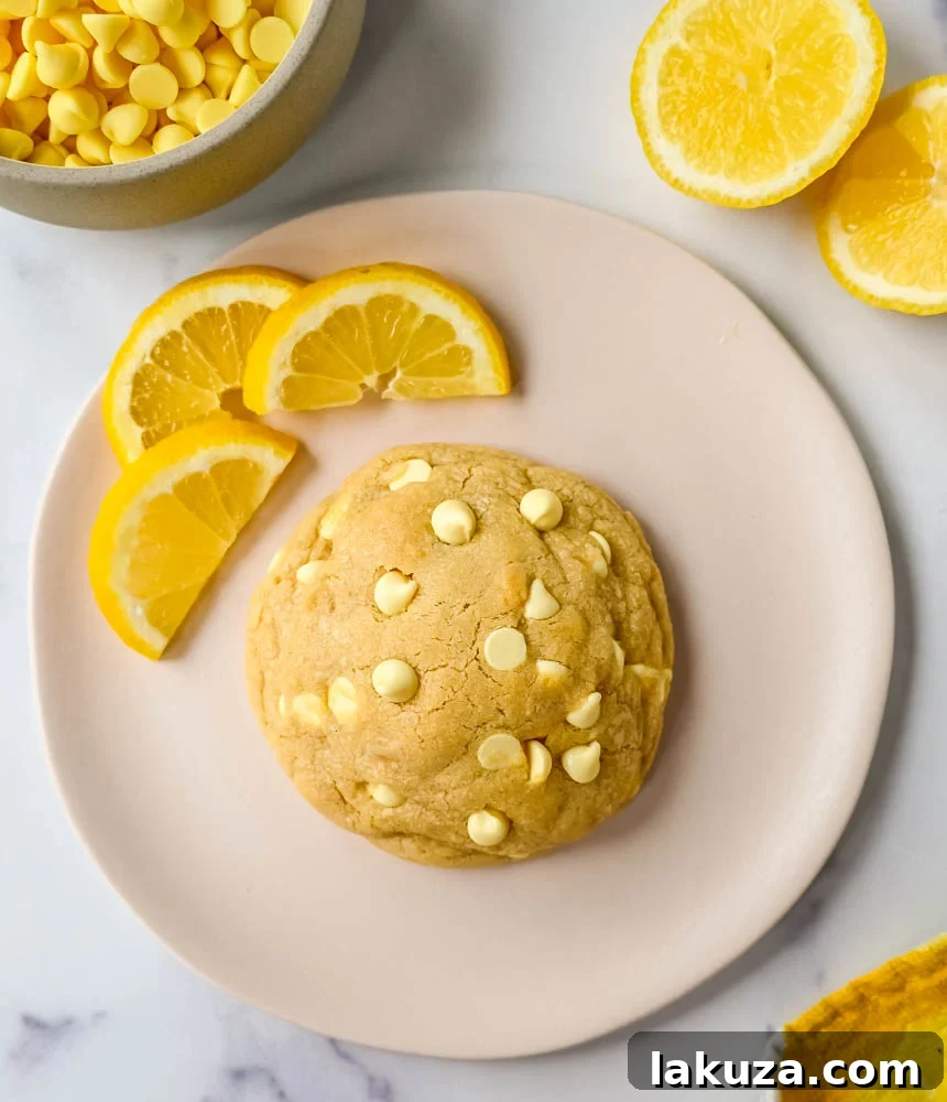 A close-up shot of a plate of Levain Bakery Lemon Cookies, showcasing the generous size and inviting texture.