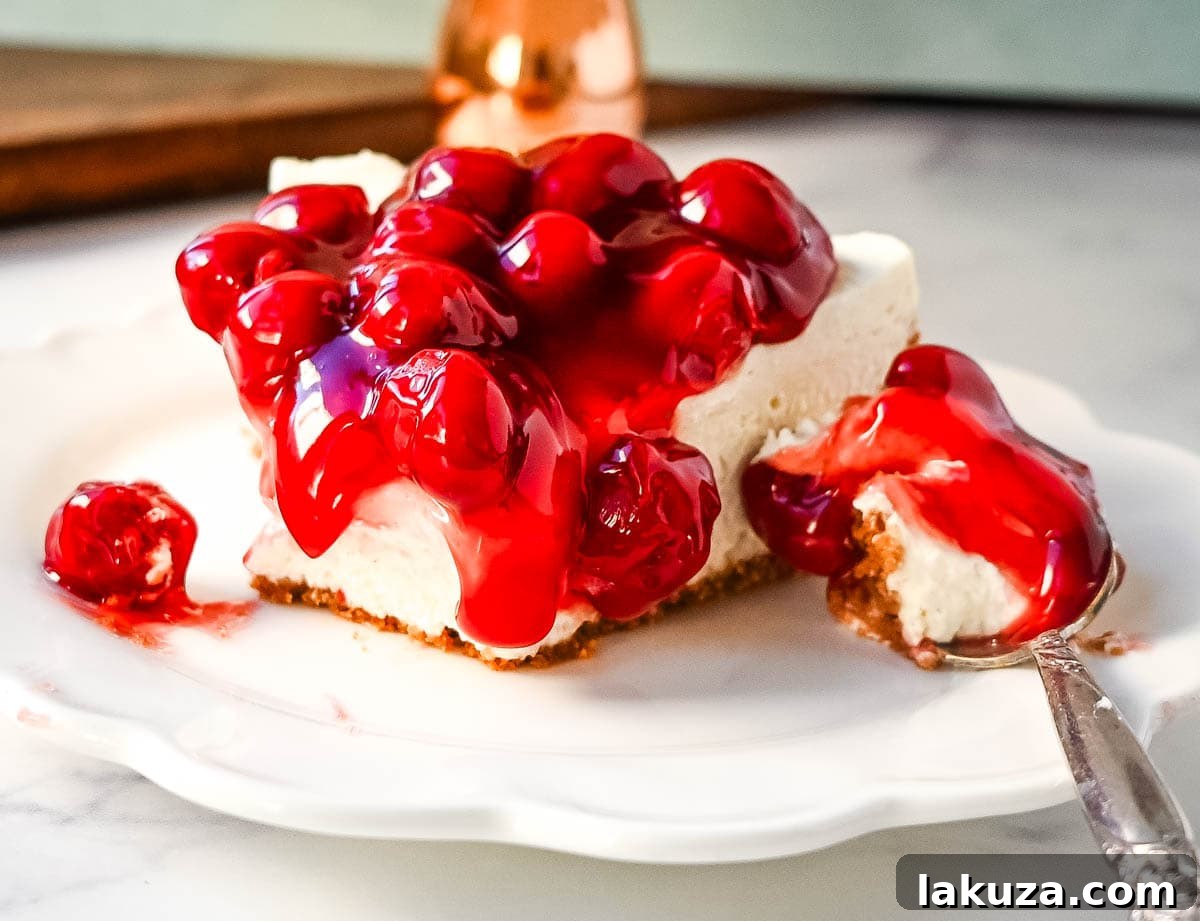 Effortless Cheesecake Delights 7 A single slice of No Bake Cheesecake topped with fresh berries.