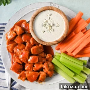 Buffalo Chicken Bites (no breading). A lighter, healthier version of buffalo chicken wings, pan-fried and tossed in a delicious sauce.