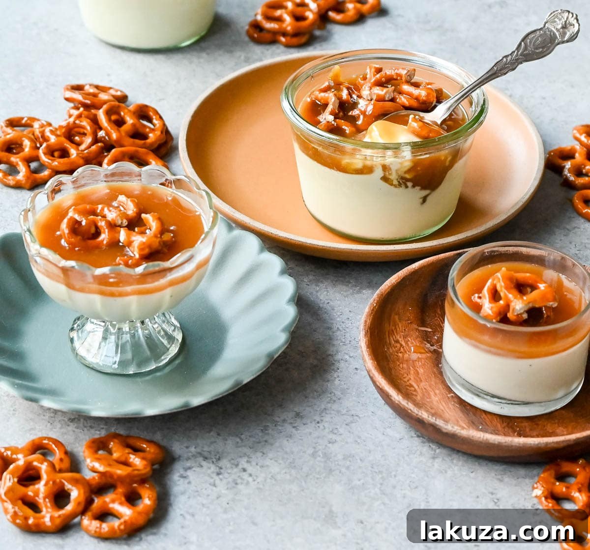 Overhead view of several panna cotta servings, with rich caramel pooling on top and scattered pretzel pieces, inviting a delightful dessert experience.
