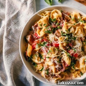 Creamy Tortellini with Prosciutto and Peas is a popular Italian pasta dish.