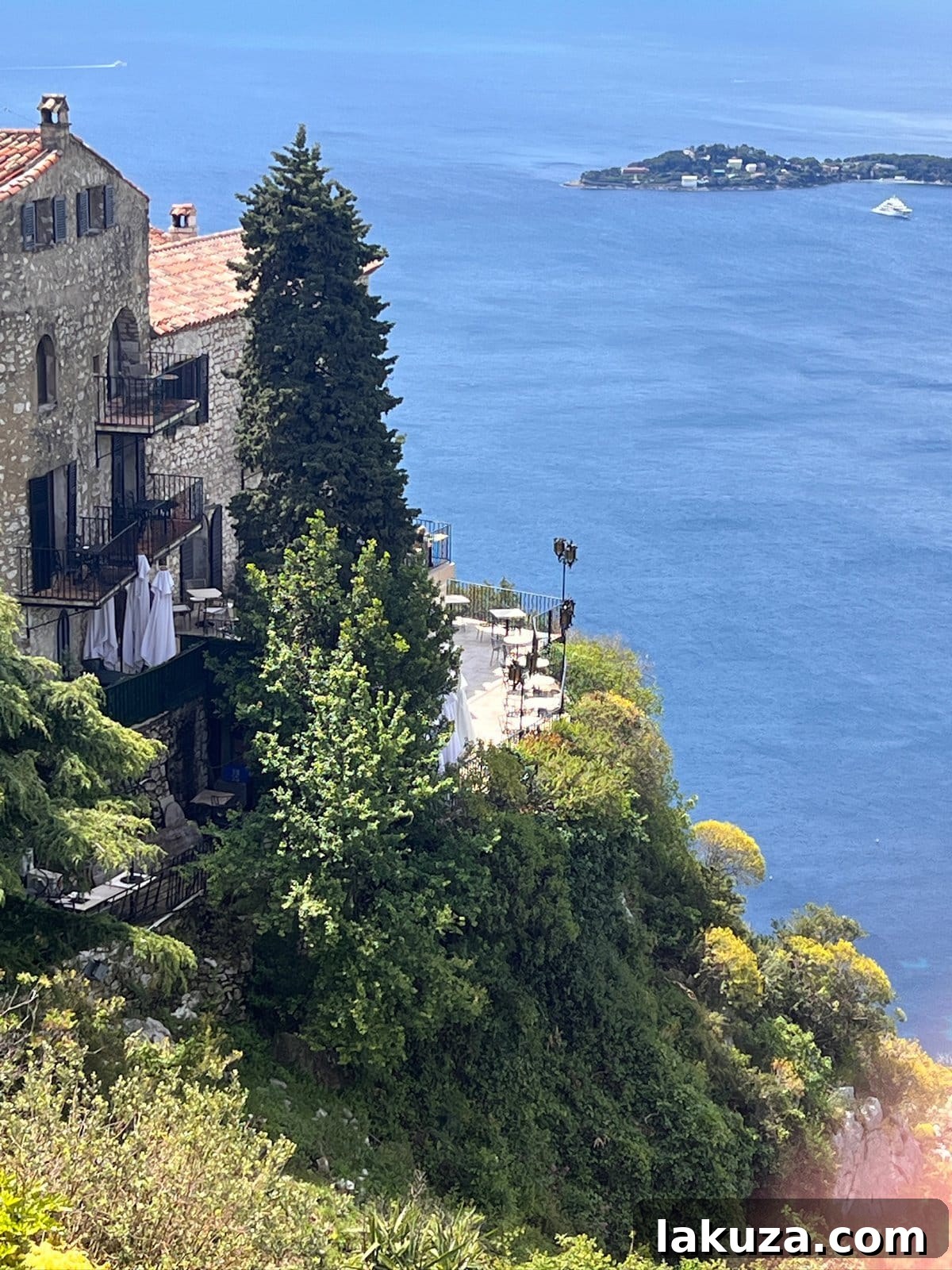 TGIF Gabfest 20 Picturesque view of an idyllic French coastal town with villas on hills overlooking the ocean