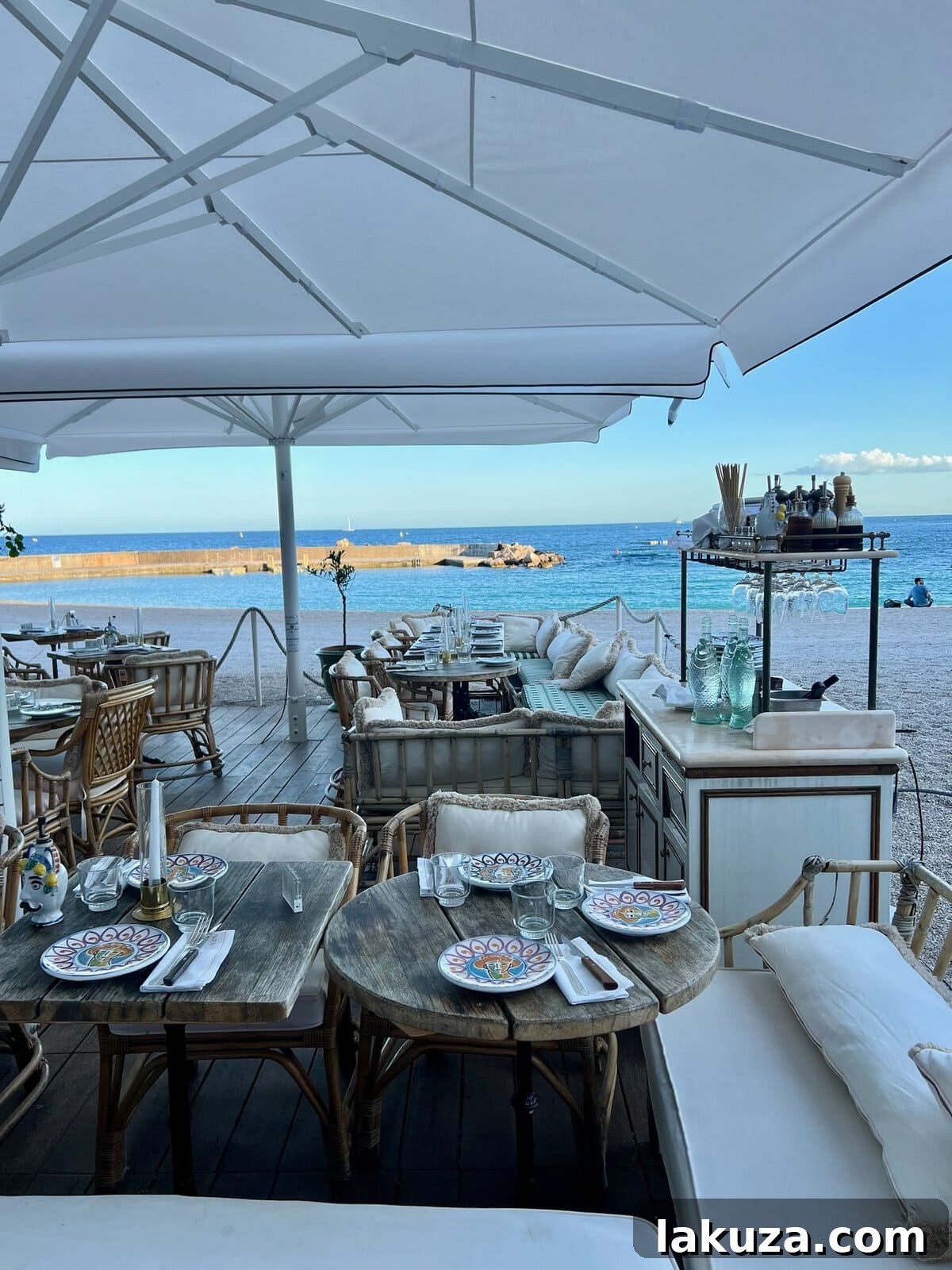 TGIF Gabfest 24 Elegant dining setting at a restaurant right on the beach in Monaco, overlooking the water