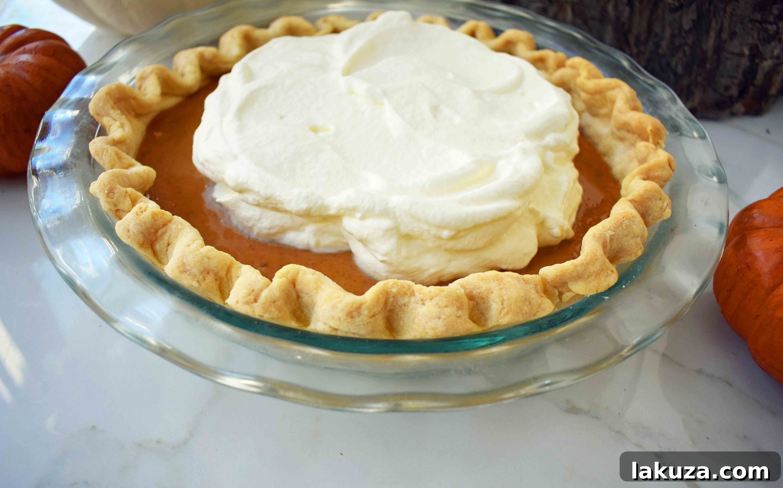 Heavenly Pumpkin Pie 4 Homemade whipped cream with a hint of vanilla, ready to top a slice of pumpkin pie.