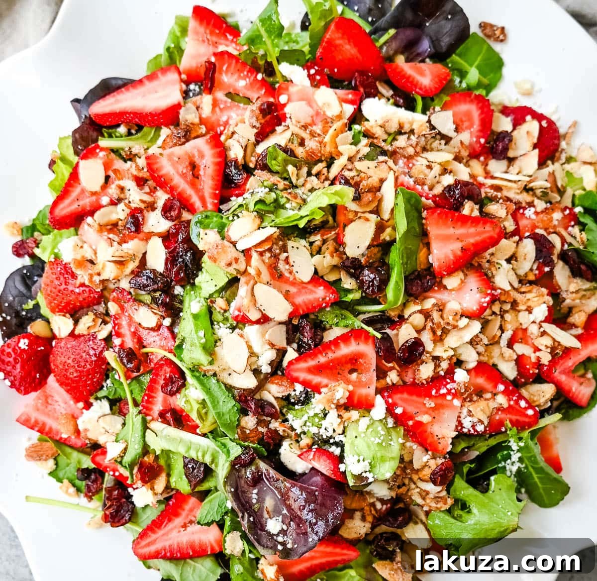 Refreshing Strawberry Spring Mix Salad 2 Strawberry Spring Mix Salad. This Strawberry Poppyseed Salad is made with spring mix, fresh strawberries, creamy and tangy feta cheese, sugared almonds, and tossed with a sweet homemade poppyseed dressing.