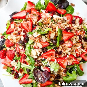 Strawberry Spring Mix Salad. This Strawberry Poppyseed Salad is made with spring mix, fresh strawberries, creamy and tangy feta cheese, sugared almonds, and tossed with a sweet homemade poppyseed dressing.