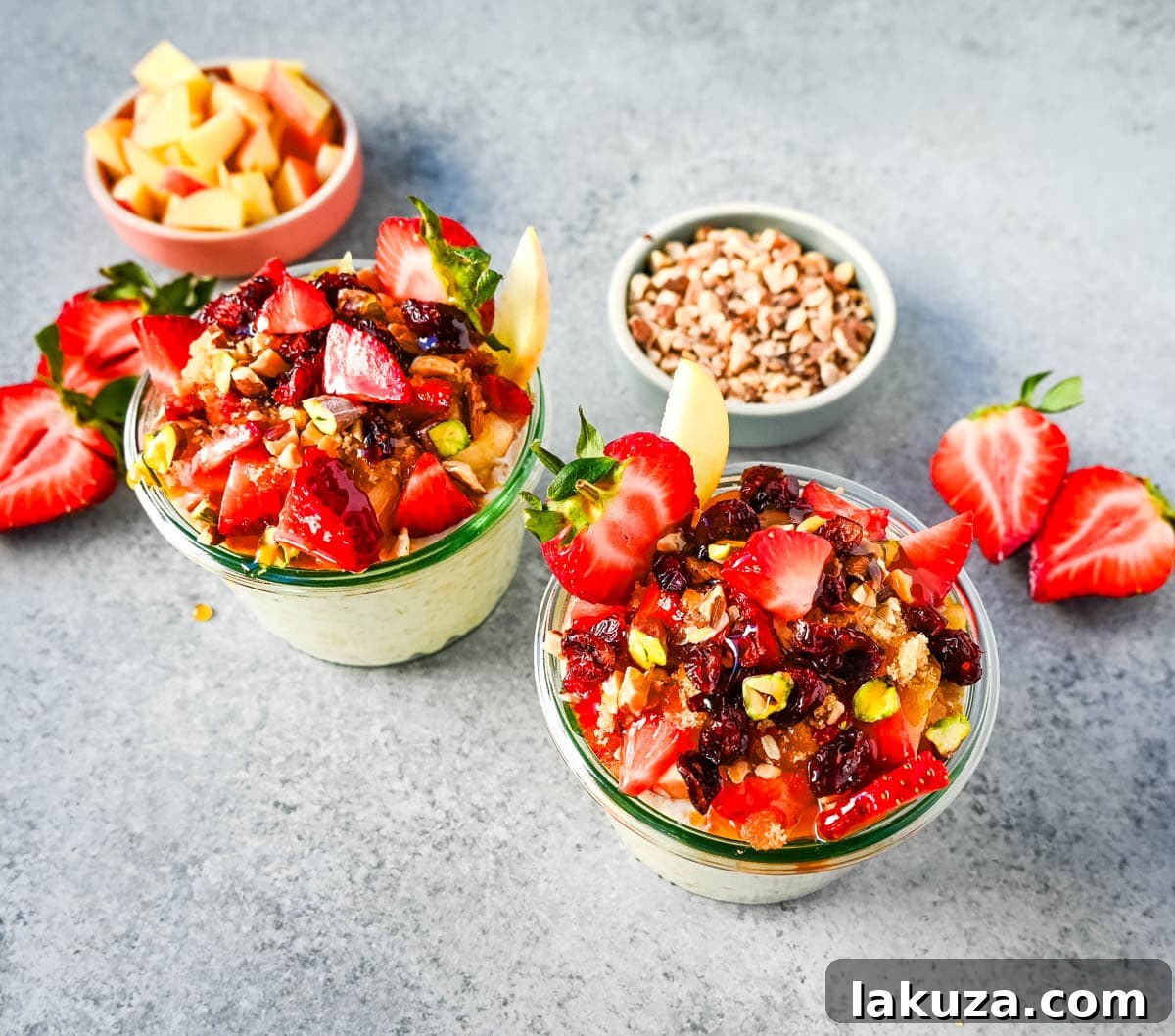 Dreamy Overnight Oats 4 A bowl of creamy Bircher Muesli Overnight Oats topped with fresh grated apple and a variety of colorful berries.