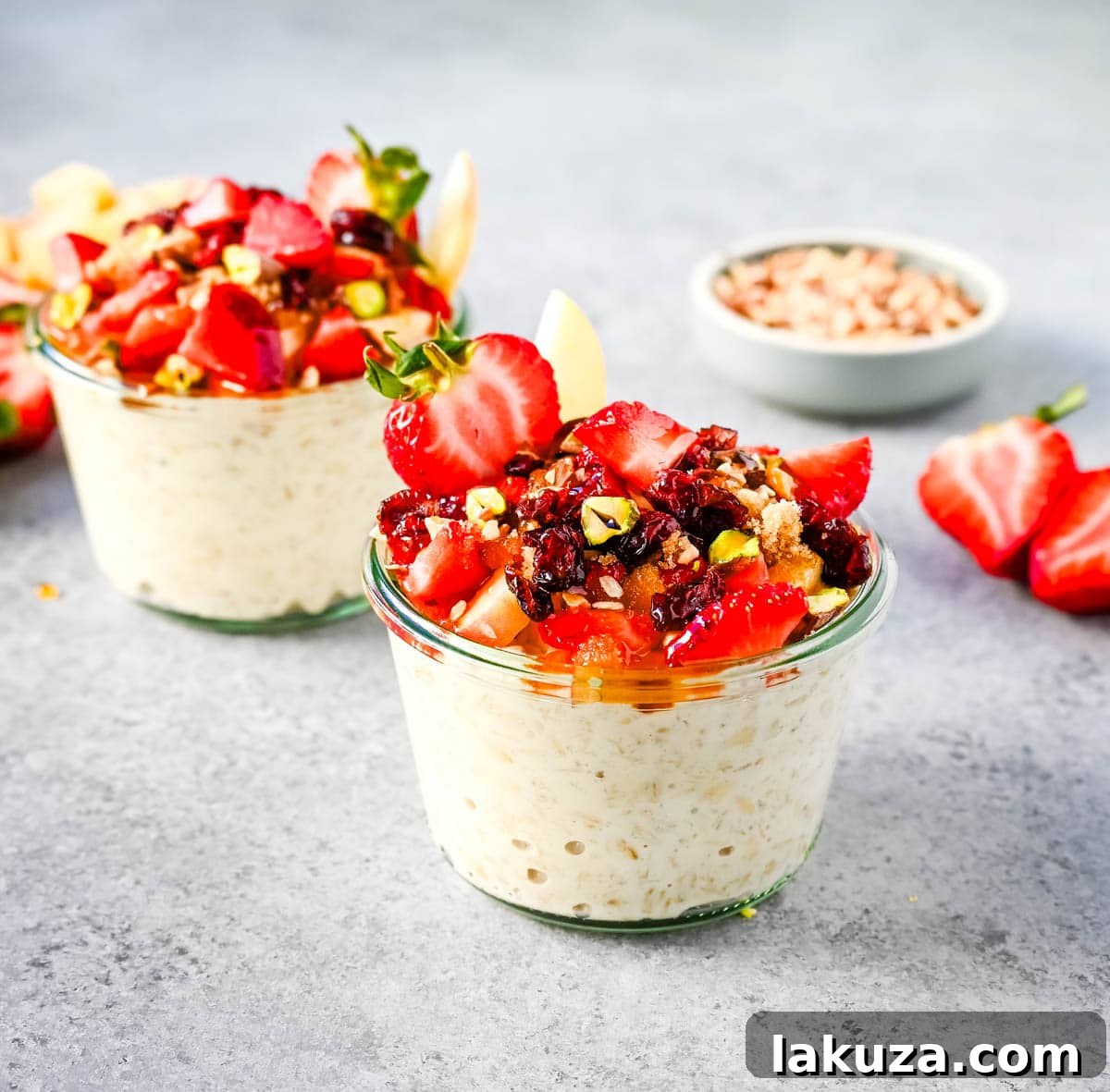 Dreamy Overnight Oats 6 A close-up shot of Bircher Muesli Overnight Oats with various nuts, seeds, and fresh fruit toppings ready to be added.