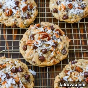 These soft, chewy, chunky Cowboy Cookies are made with oats, chocolate chips, shredded coconut, and pecans making them perfectly sweet, salty, nutty, and hearty. This is the best Cowboy Cookies recipe!
