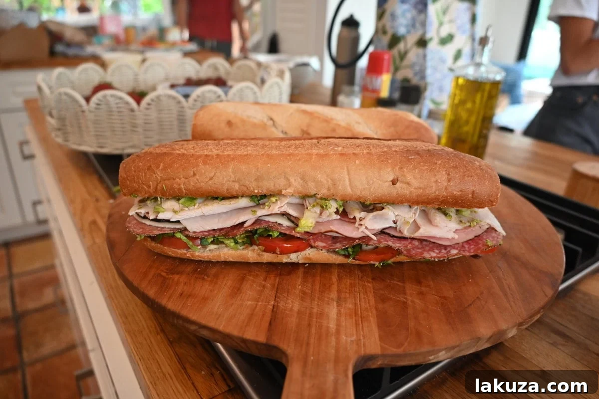 A delicious Italian sub sandwich, cut in half and ready to eat