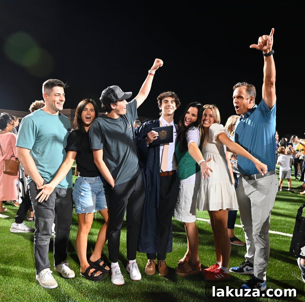 A candid shot of Carson celebrating his high school graduation with family