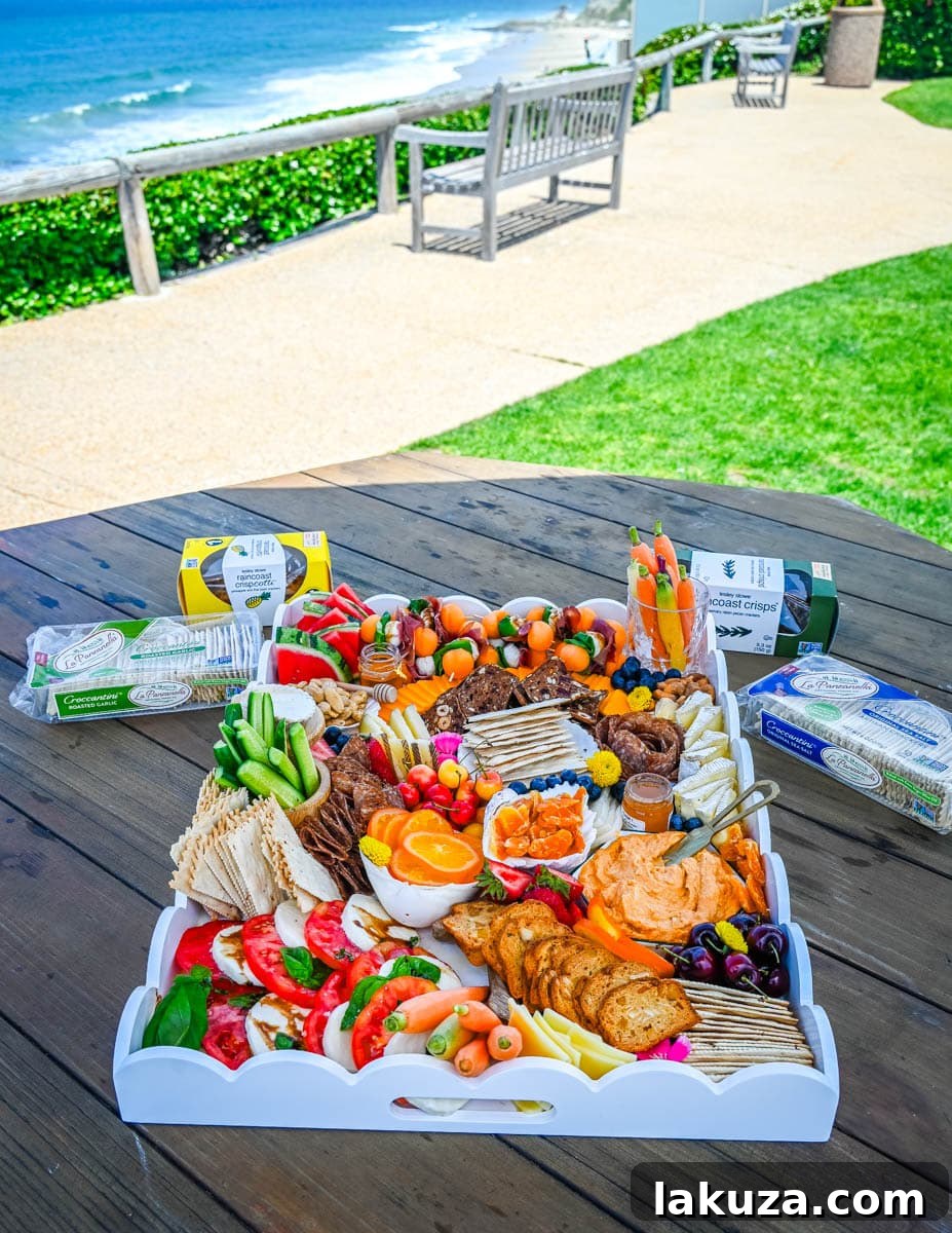 An overhead view of a beautifully prepared summer charcuterie board, showcasing the art of food arrangement.
