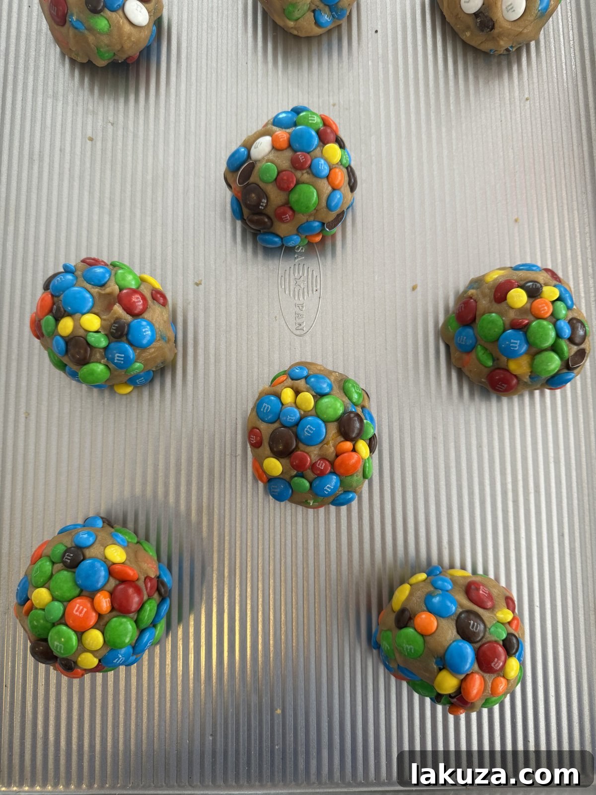 A plate of freshly baked M&M cookies, colorful and inviting