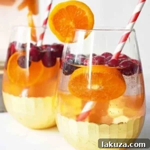 The Henry Cranberry Orange Mocktail, a perfect non-alcoholic party drink.