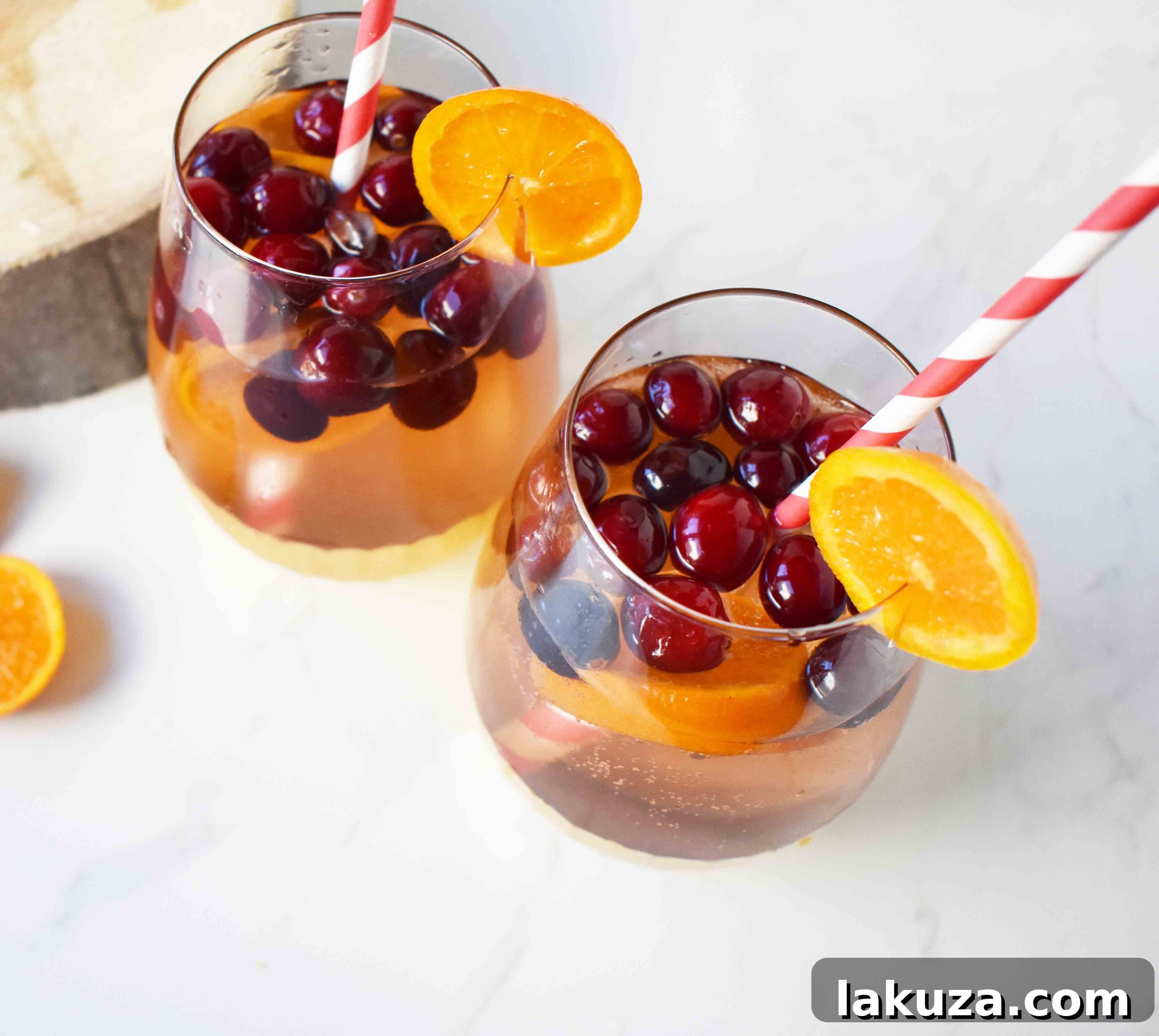 The Henry Crimson Citrus Sparkler 6 The Henry Cranberry Orange Mocktail in a large pitcher, ready for serving.