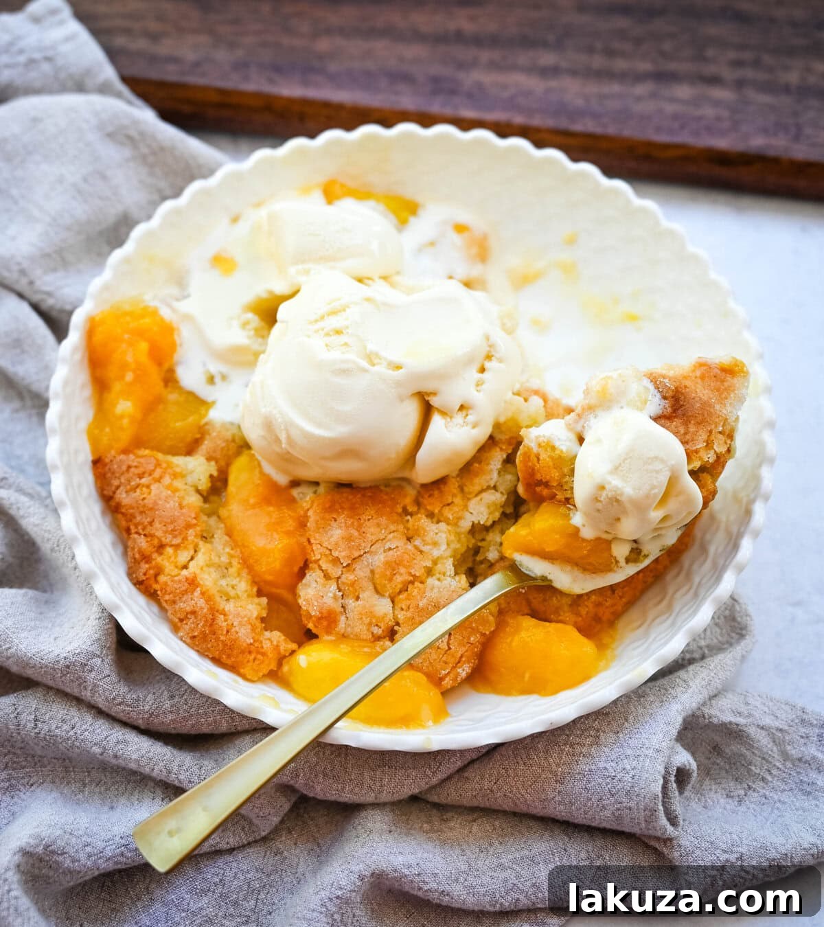 Another beautiful shot of the homemade nectarine cobbler, highlighting its golden-brown crust and juicy fruit filling, ready to be enjoyed.