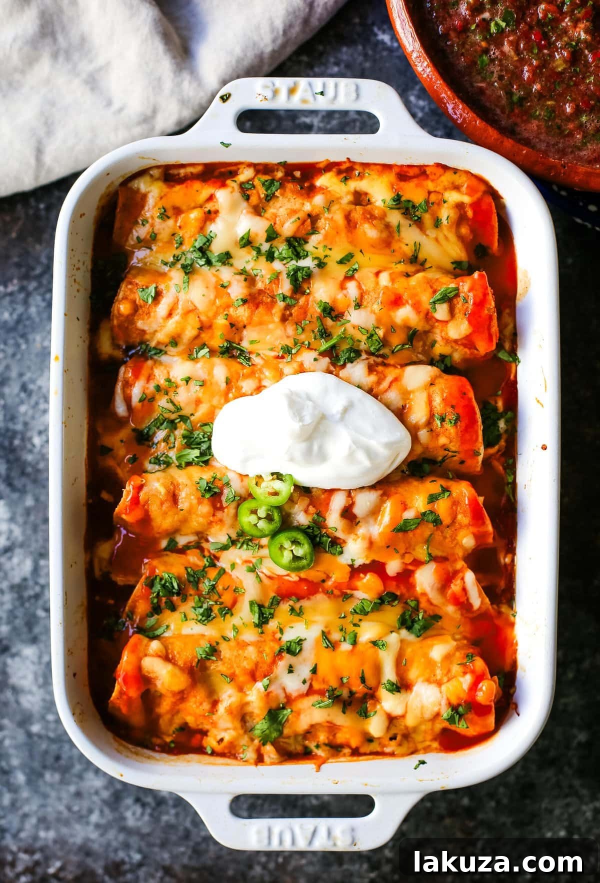 Simple Weeknight Chicken Enchiladas 2 How to make Quick and Easy Chicken Enchiladas with only a few ingredients. This delicious chicken enchiladas recipe is super simple and a crowd pleaser.