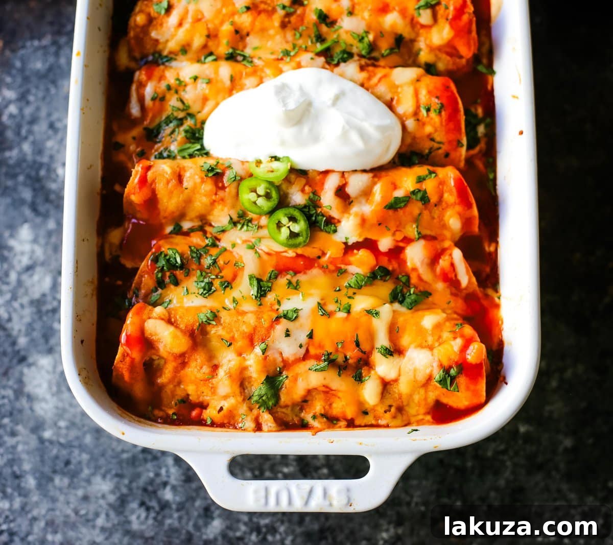 Simple Weeknight Chicken Enchiladas 7 Close-up of baked Quick and Easy Chicken Enchiladas with fresh toppings.