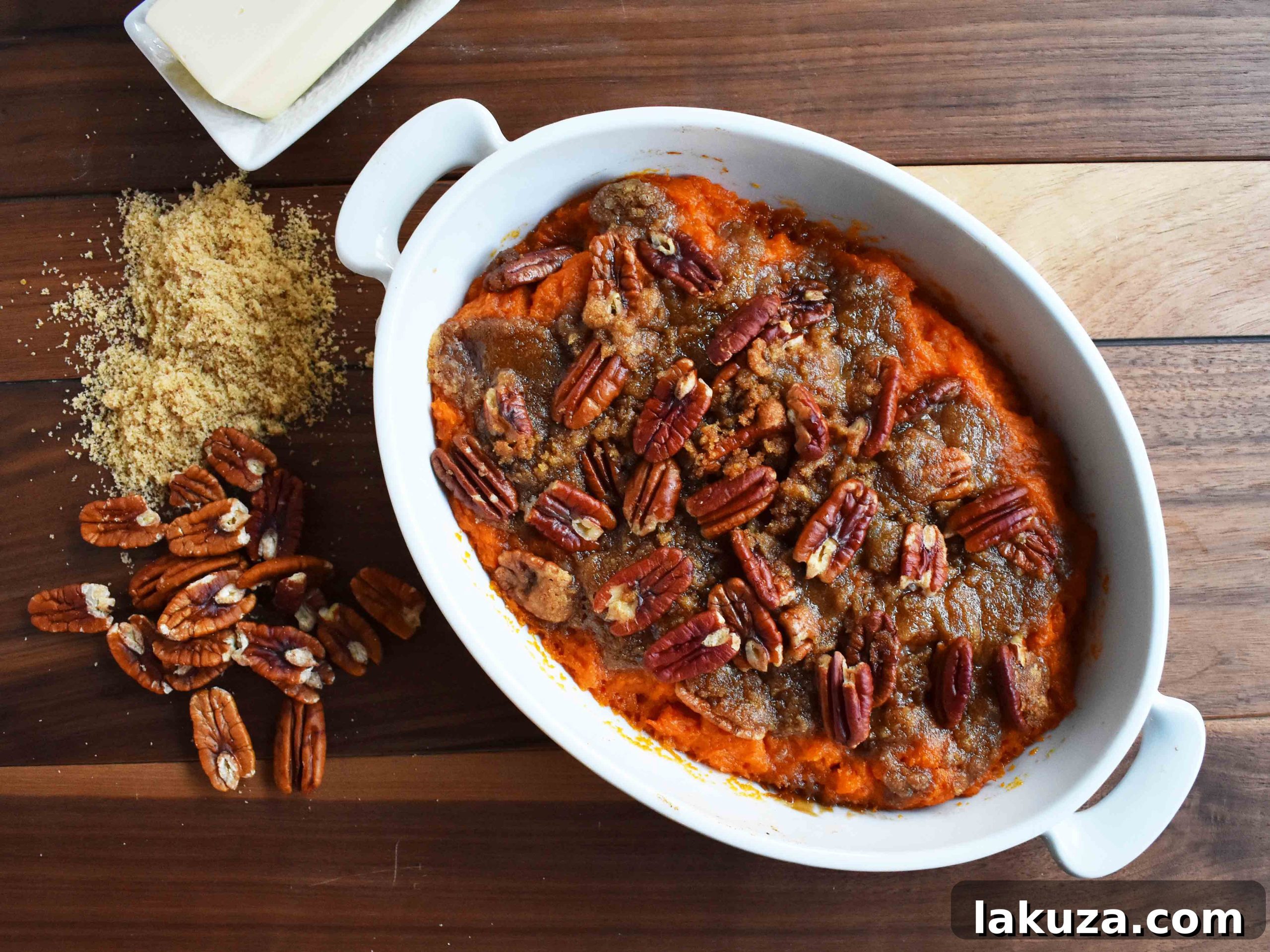Sweet Potato Brown Sugar Pecan Bake by Modern Honey featuring a creamy vanilla cinnamon sweet potato base and a crunchy brown sugar pecan topping.
