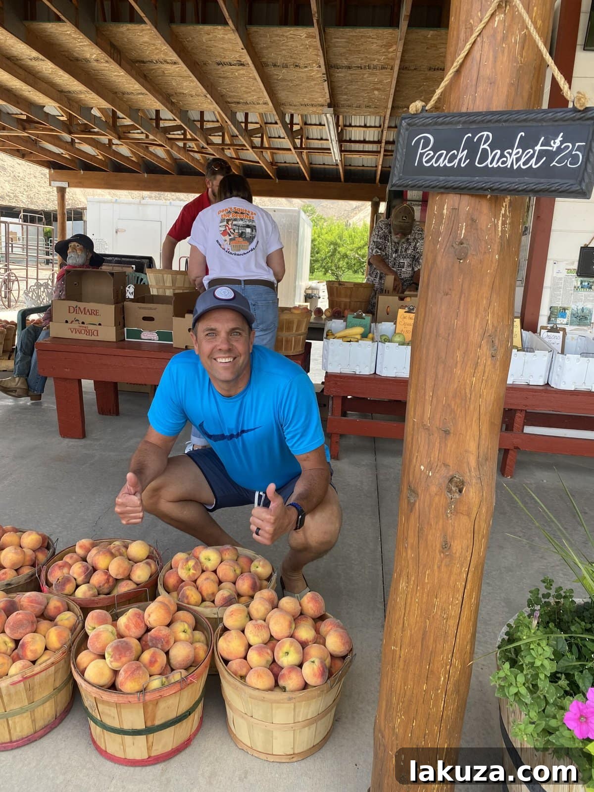 Close-up of fresh, ripe peaches on a wooden surface, ideal for preparing a homemade peach galette.