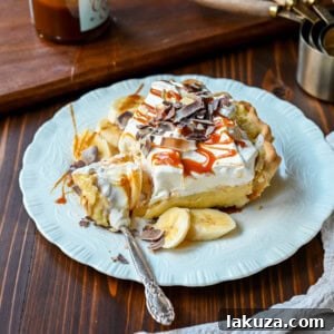 This Caramel Banana Cream Pie is made with a Homemade custard, fresh bananas, and rich salted caramel in a buttery pie crust. The ultimate caramel banana cream pie!