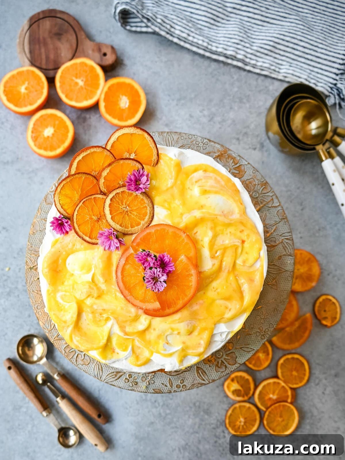 Slice of Orange Olive Oil Cake with whipped cream and orange curd