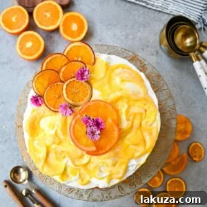Orange Olive Oil Cake slice with whipped cream and orange curd