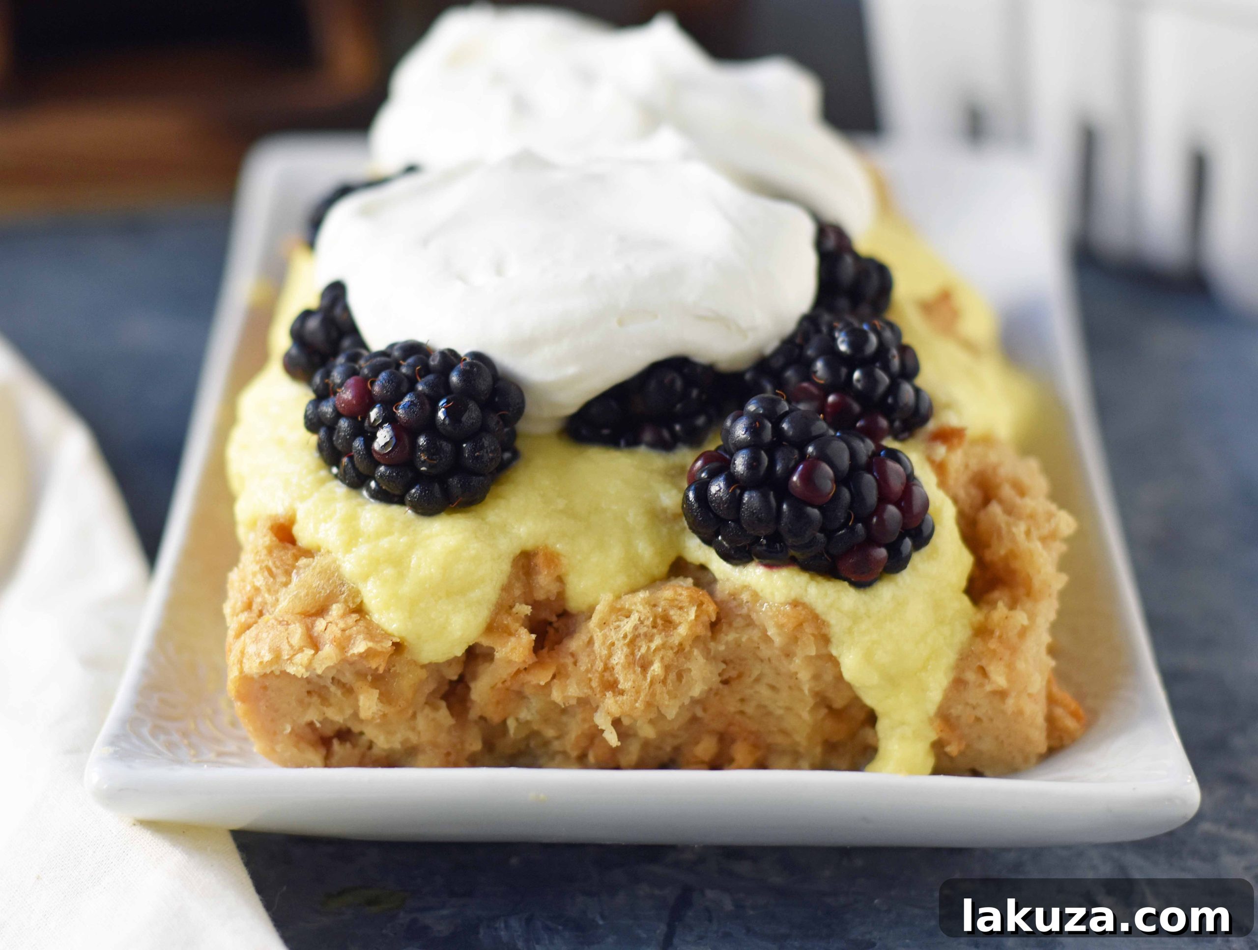 Decadent Blackberry Bread Pudding 2 Blackberry Bread Pudding with a warm brown sugar bread pudding topped with homemade creme anglaise sauce and fresh whipped cream. www.modernhoney.com
